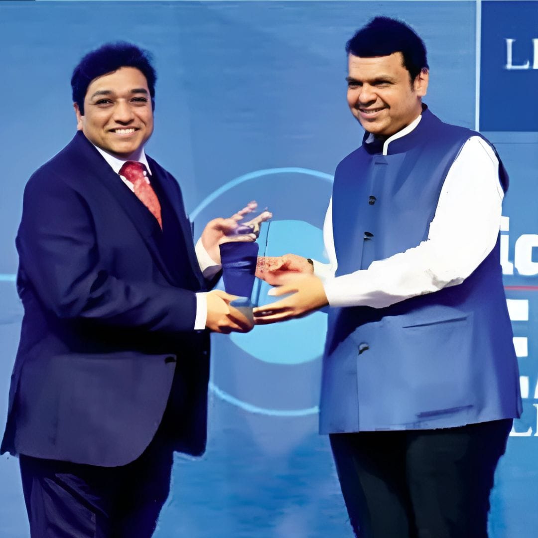 Dr. Vinod Sonawane recieving the best hair transplant award from Maharashtra's CM Mr. Devendra Fadnavis